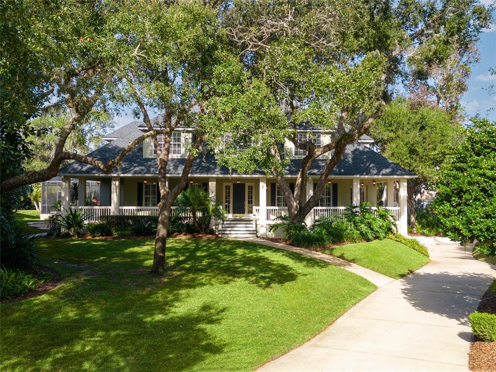 7 Bulow's Landing Flagler Beach, FL 32136 - Photo 1 of 92 a front view of house with yard and green space