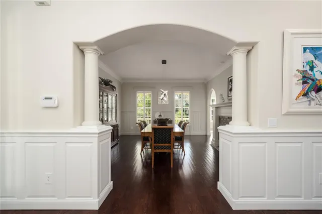 a view of a dining room with furniture window and wooden floor