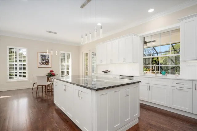 a view of an outdoor dining space with furniture and garden view