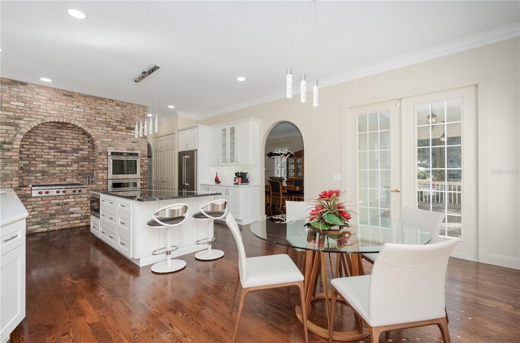 7 Bulow's Landing Flagler Beach, FL 32136 - Photo 25 of 92 a view of a dining room with furniture window and wooden floor