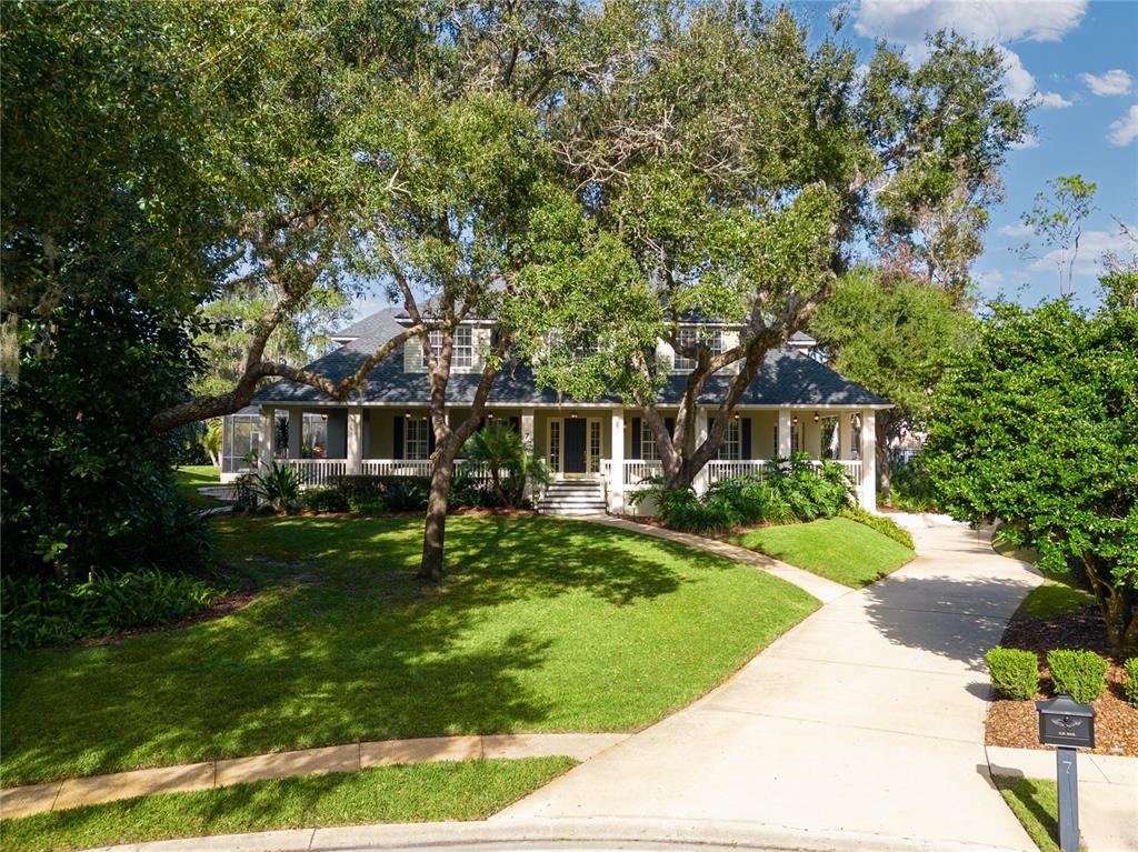 7 Bulow's Landing Flagler Beach, FL 32136 - Photo 3 of 92 a front view of a house with a garden