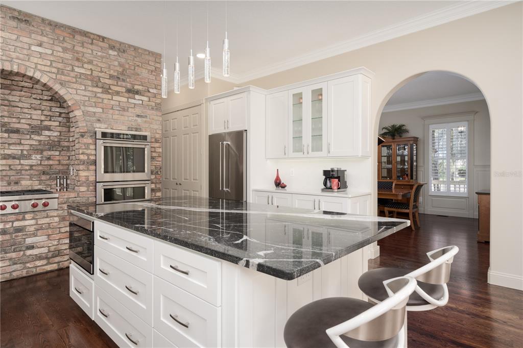 7 Bulow's Landing Flagler Beach, FL 32136 - Photo 31 of 92 a kitchen with stainless steel appliances granite countertop a sink and a refrigerator