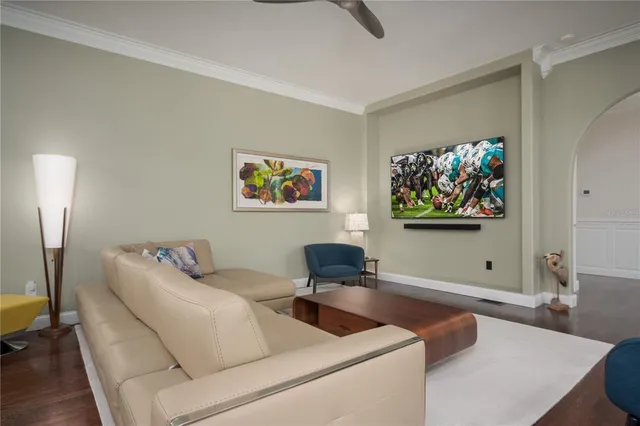 a bedroom with a bed and a car parked