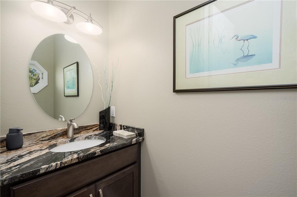 7 Bulow's Landing Flagler Beach, FL 32136 - Photo 47 of 92 a bathroom with a granite countertop sink and a mirror