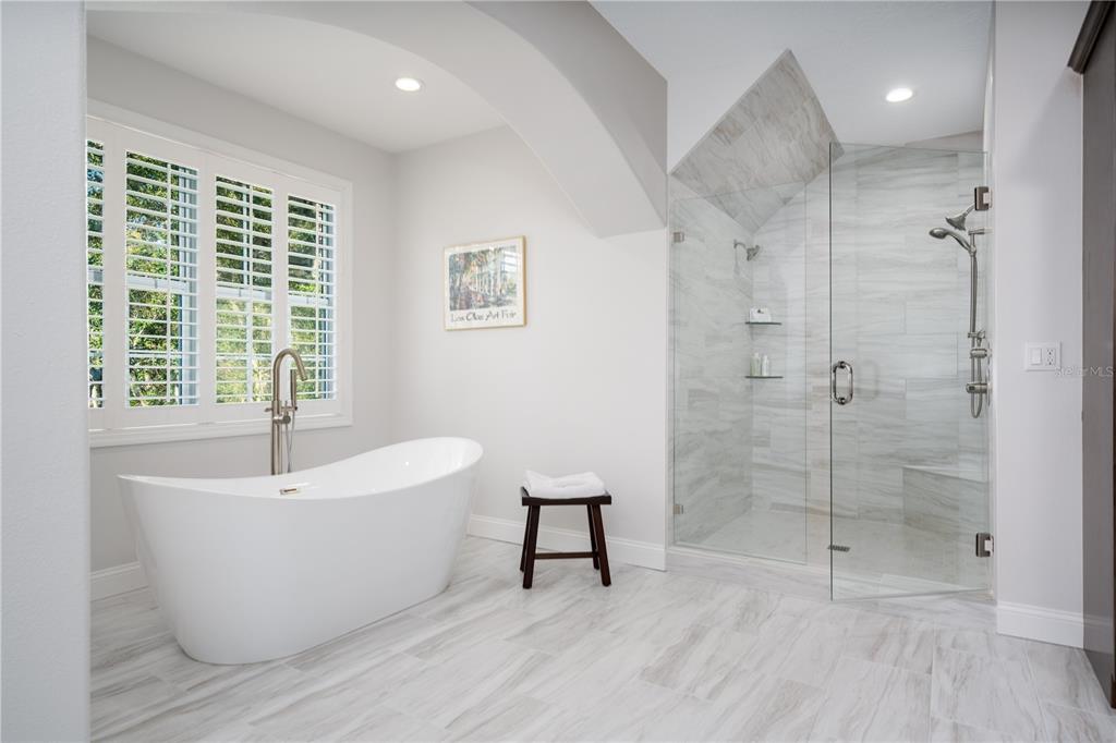 7 Bulow's Landing Flagler Beach, FL 32136 - Photo 55 of 92 a white bath tub sitting in a bathroom next to a window