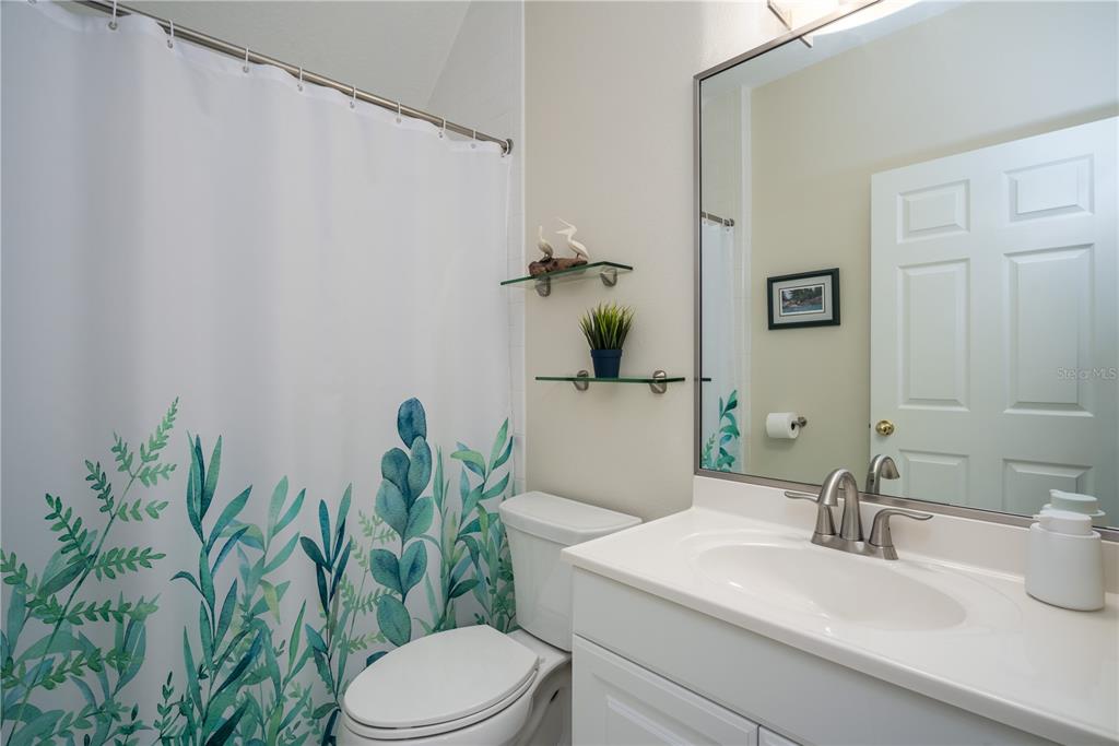 7 Bulow's Landing Flagler Beach, FL 32136 - Photo 61 of 92 a bathroom with a sink a toilet and mirror
