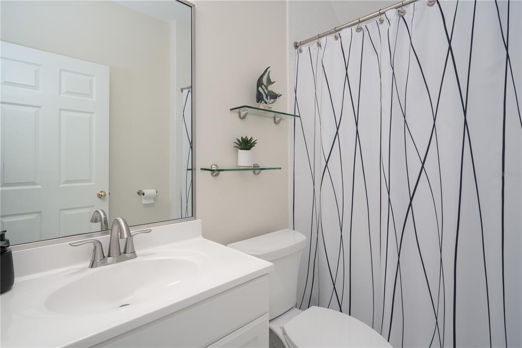 7 Bulow's Landing Flagler Beach, FL 32136 - Photo 64 of 92 a bathroom with a toilet a sink and shower