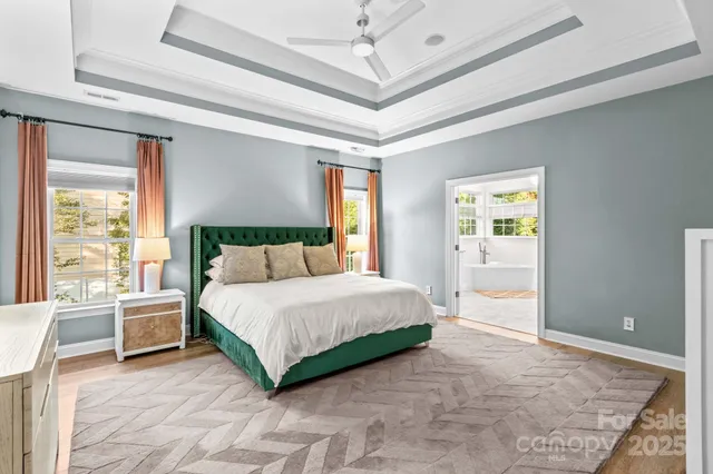 a bathroom with a double vanity sink a mirror a window and a shower