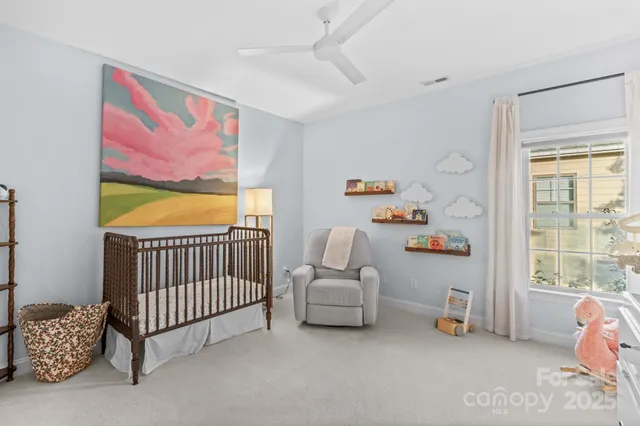 a bedroom with furniture and a mirror