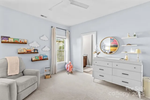 a view of a patio with a dining table and chairs with wooden floor
