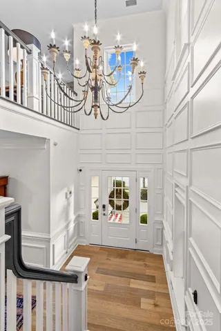 a view of a livingroom with furniture and chandelier