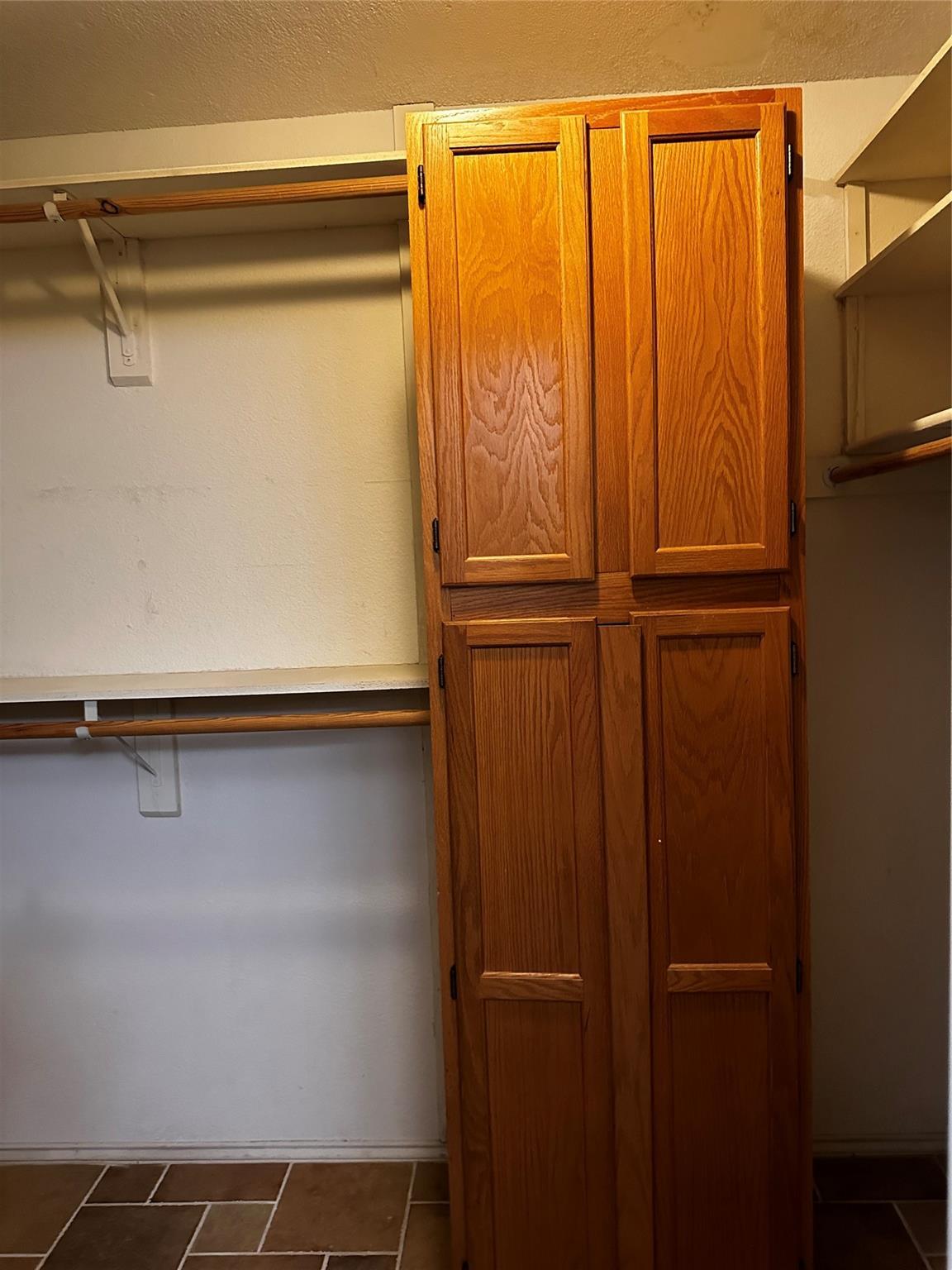 8007 Bounty Trail Austin, TX 78749 - Photo 22 of 32 Functional pantry storage and ample hanging space complete this organized utility area.