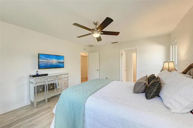 a bedroom with a bed and a desk