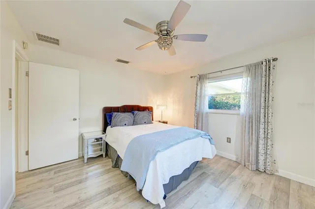 a bedroom with a bed and window