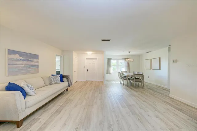 a living room with furniture and a table