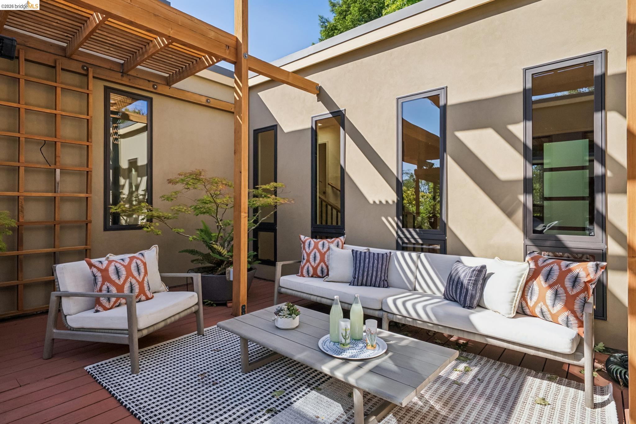 576 Vistamont Avenue Berkeley, CA 94708 - Photo 16 of 33 Private outdoor patio featuring a wood pergola and a slatted wood trellis