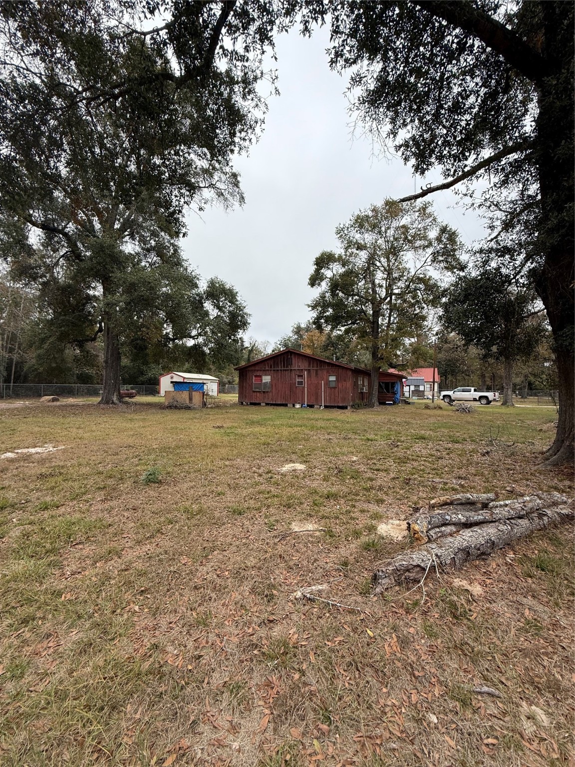 281 Scott Road Cleveland, TX 77328 - Photo 4 of 7 a view of green field with trees in the background