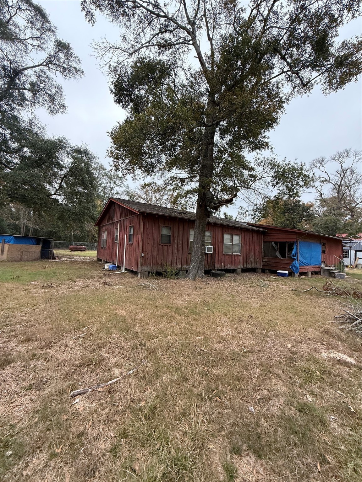 281 Scott Road Cleveland, TX 77328 - Photo 5 of 7 a view of a barn in the middle of a yard