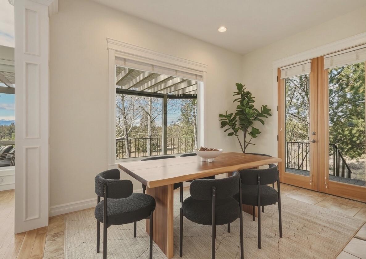 21450 Dale Road Bend, OR 97701 - Photo 27 of 75 An inviting informal dining area with access out to the deck for easy everyday living and effortless entertaining.