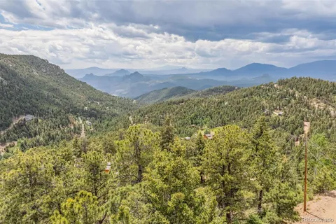 a view of a large building with a mountain in the background