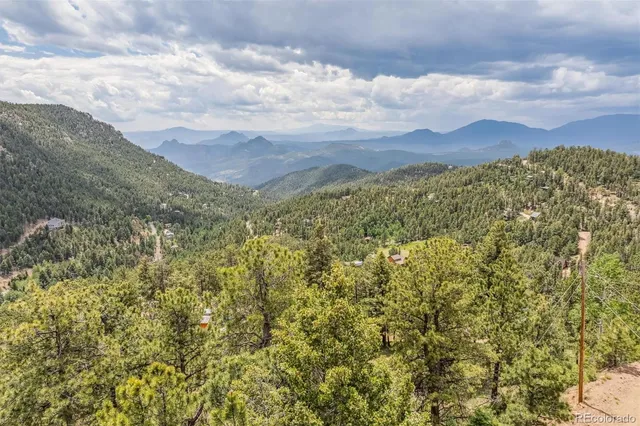 a view of a large building with a mountain in the background