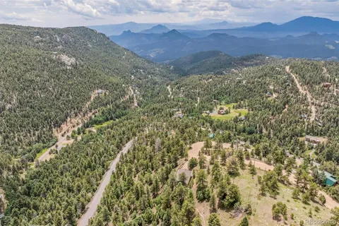 a view of a city with mountains in the background