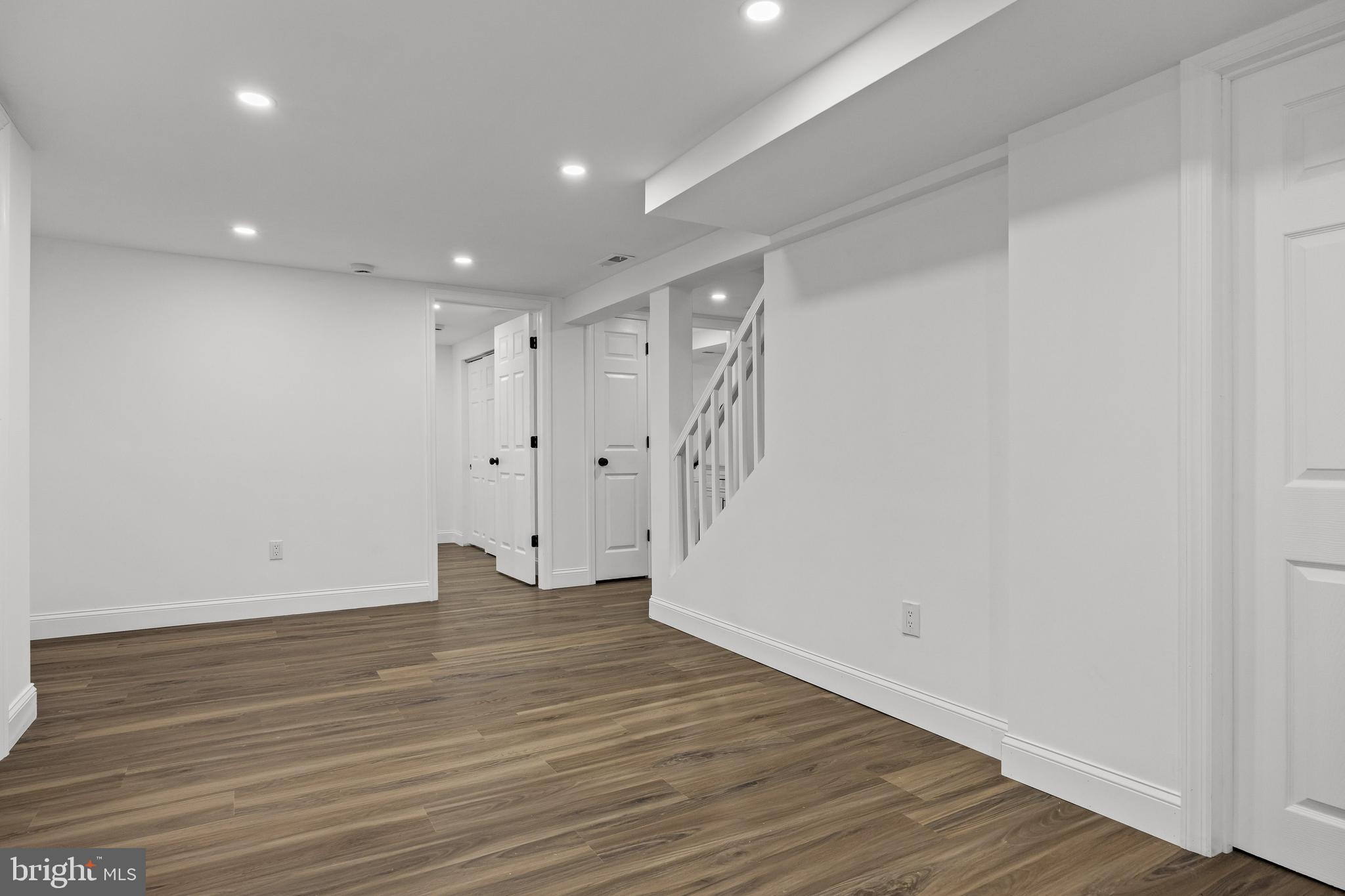 937 Clements Bridge Road Barrington, NJ 08007 - Photo 33 of 34 a view of an empty room with wooden floor