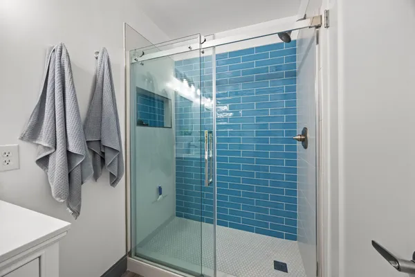 a bathroom with a shower and a tub