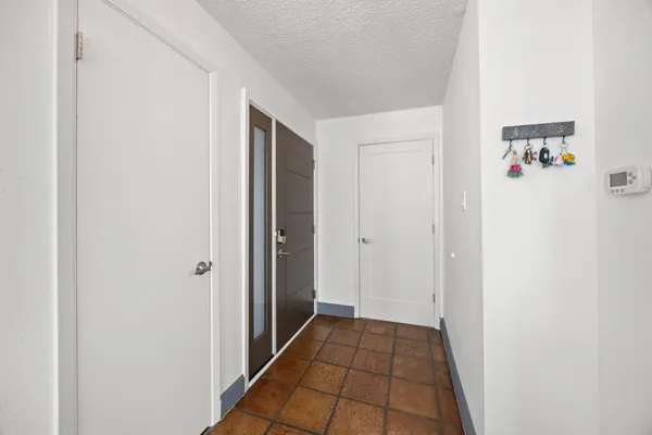 a view of a hallway and closet