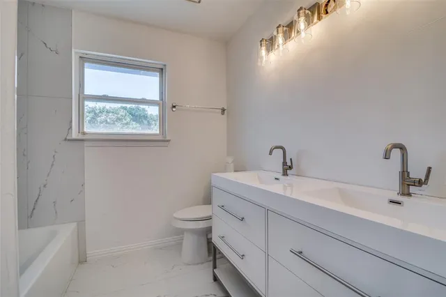 a bathroom with a sink and a bathtub