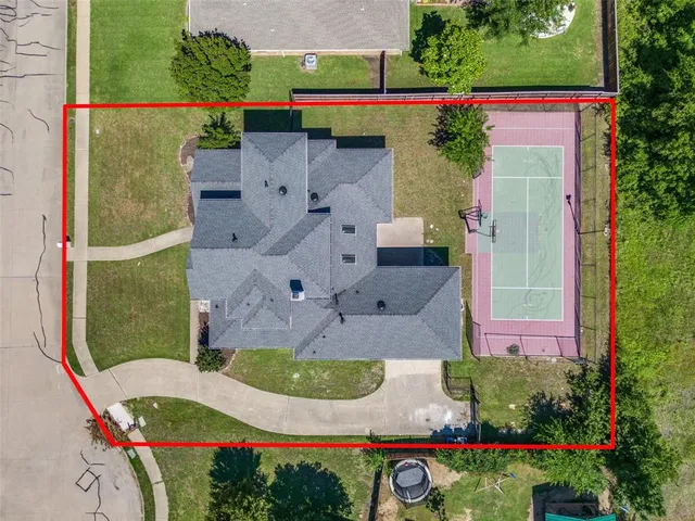 an aerial view of a house with outdoor space