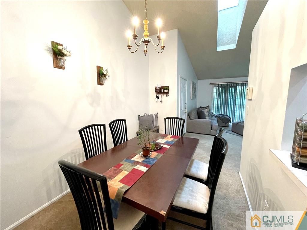 341 Wimbeldon Court North Brunswick, NJ 08902 - Photo 5 of 16 a view of a dining room with furniture
