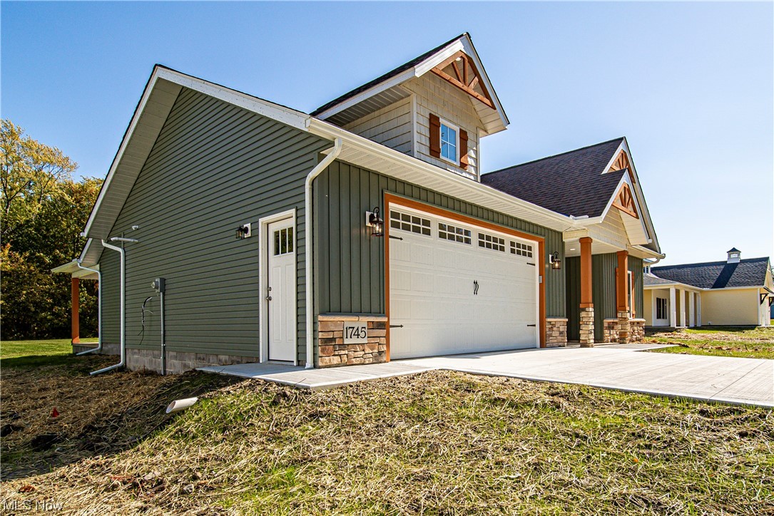 1745 Green Road Madison, OH 44057 - Photo 3 of 35 View of front of house featuring a garage