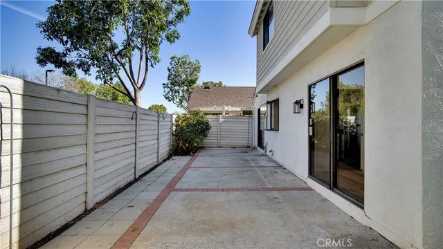 a view of a pathway both side of house