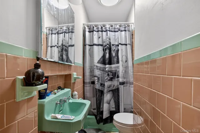 a living room with furniture a rug and a window