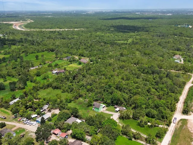 a view of a lush green outdoor space with a lake view and mountain view