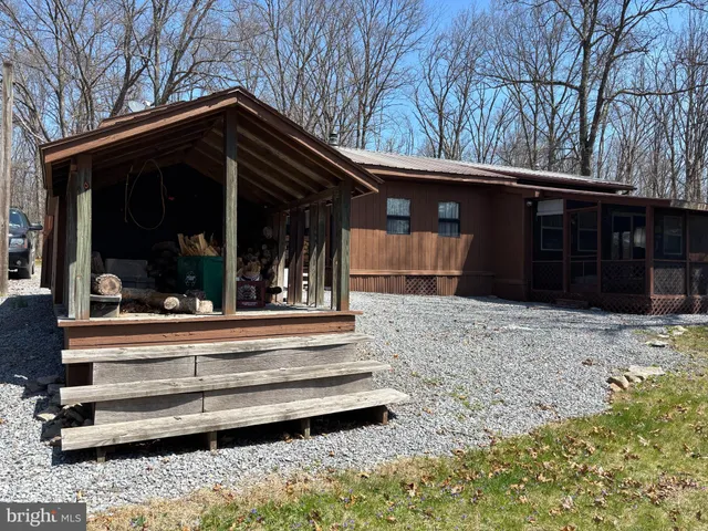 a view of house with outdoor space and porch