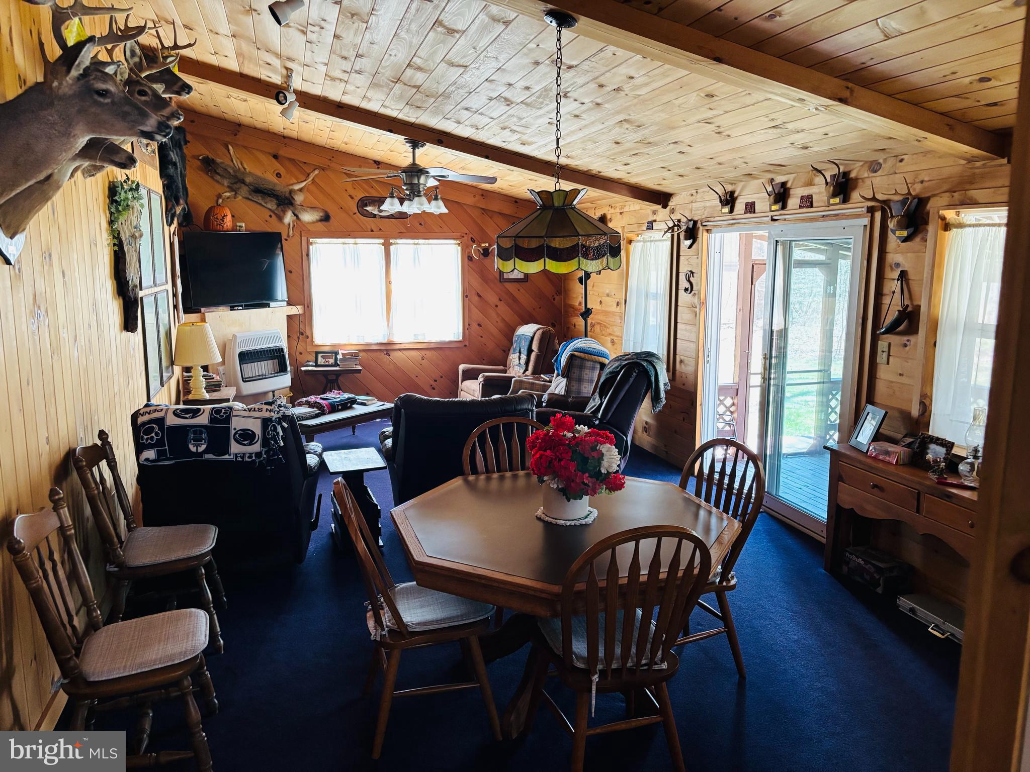 1066 Eddy Ridge Road Orviston, PA 16864 - Photo 19 of 44 a view of a dining room with furniture window and wooden floor