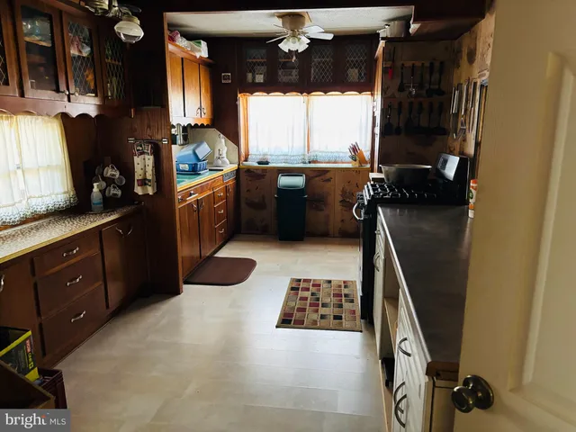 a kitchen with a sink appliances and cabinets