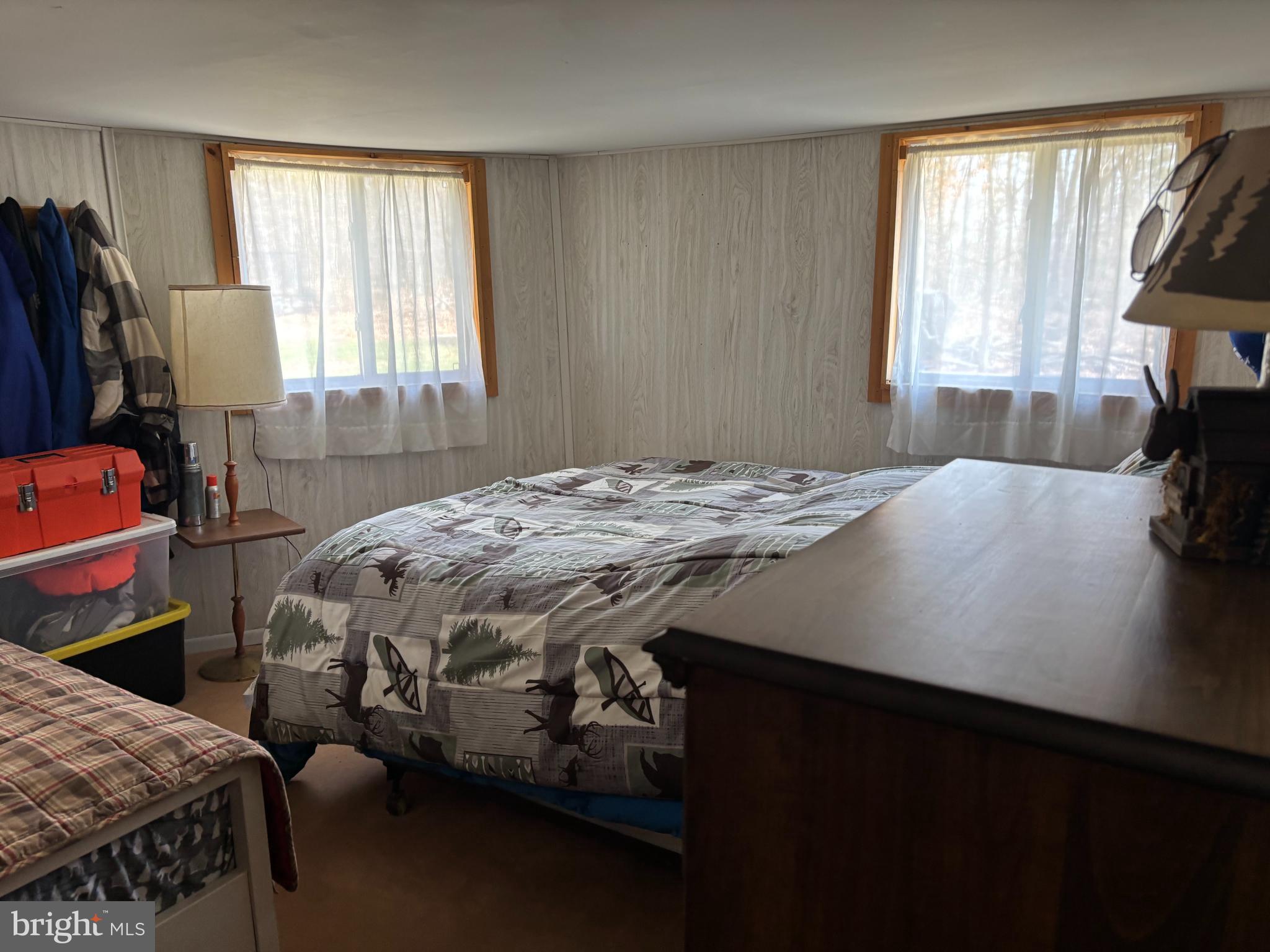 1066 Eddy Ridge Road Orviston, PA 16864 - Photo 26 of 44 a bedroom with a bed and a window