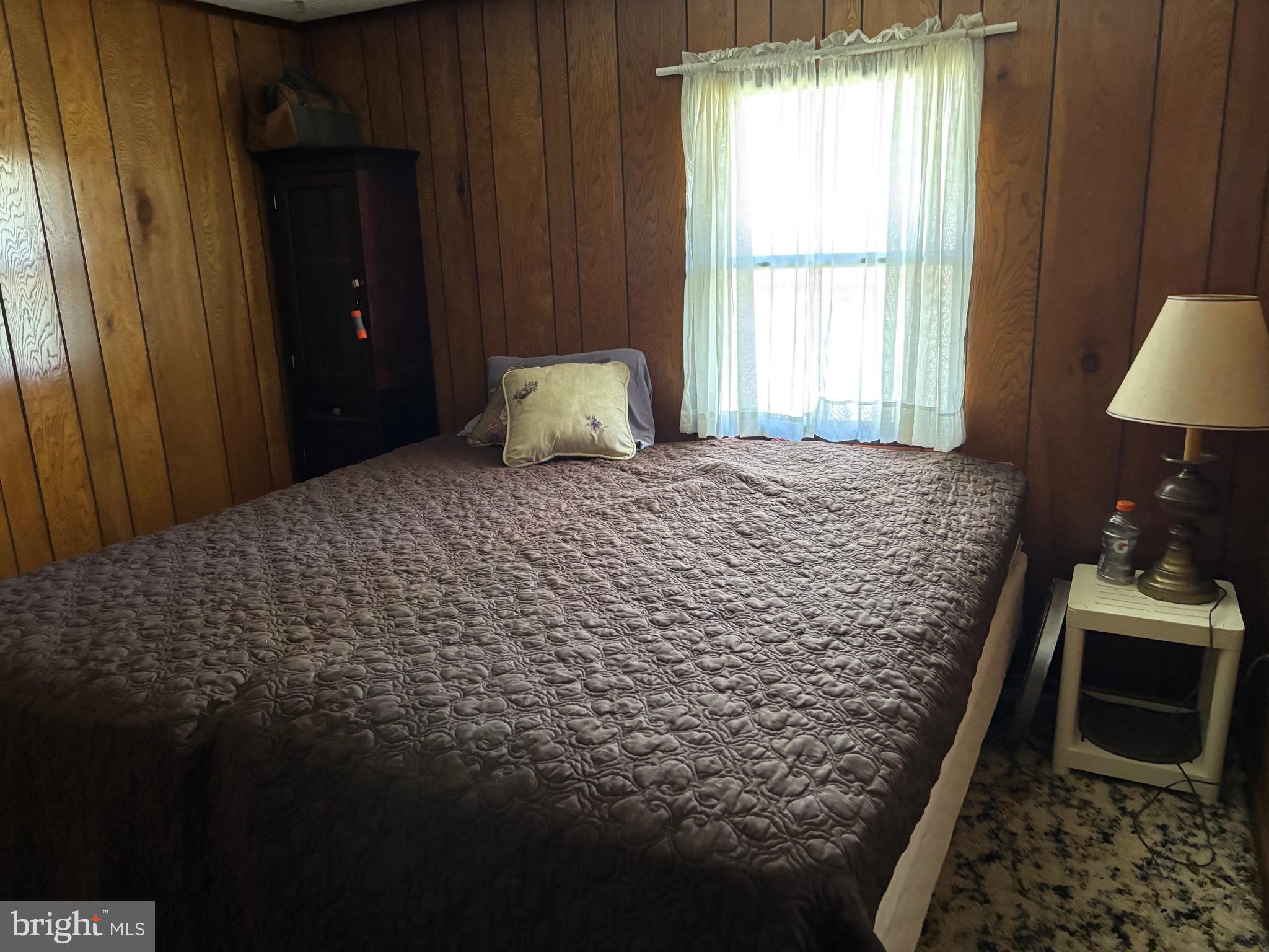 1066 Eddy Ridge Road Orviston, PA 16864 - Photo 27 of 44 a bedroom with a bed and a window