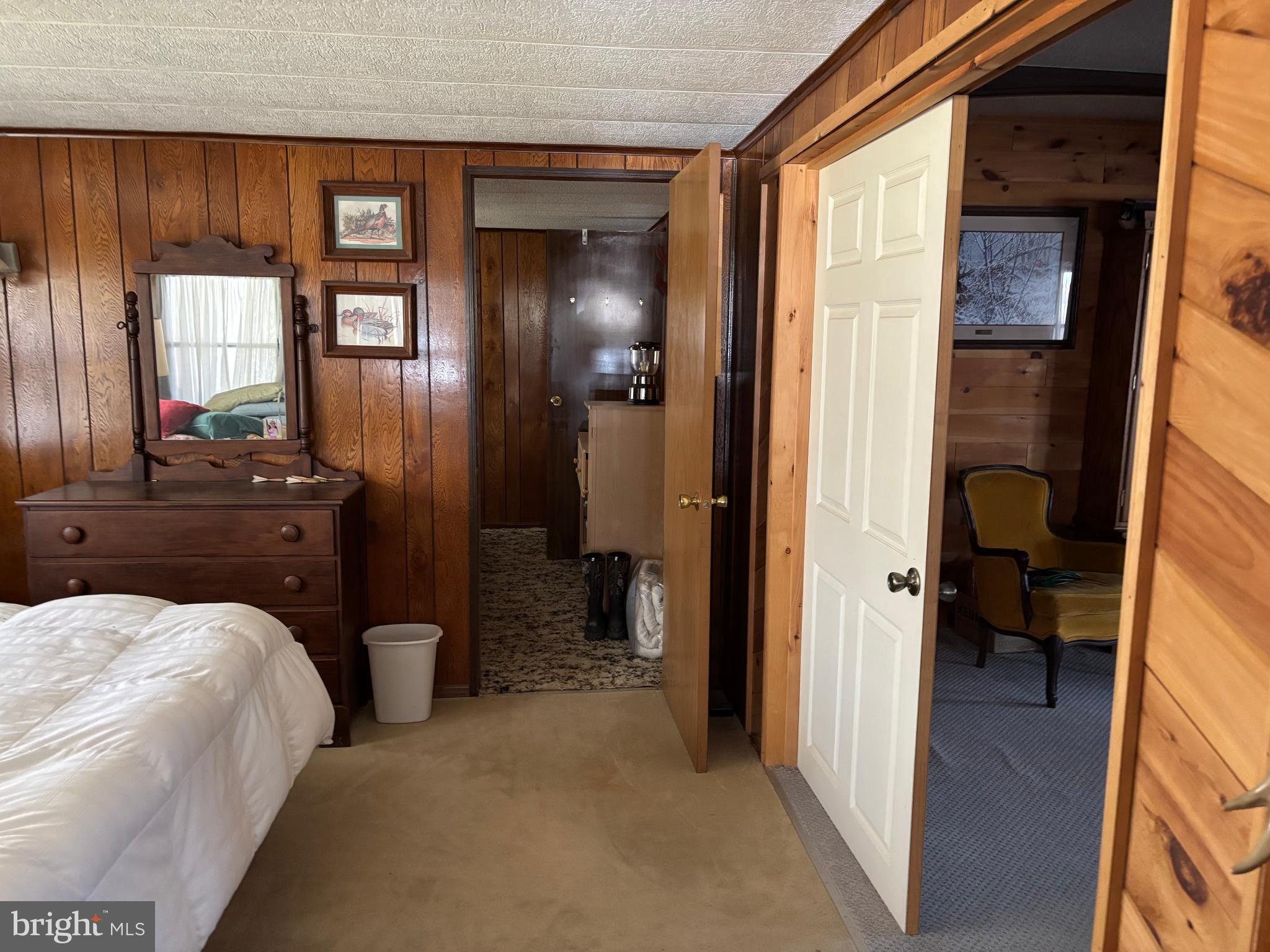 1066 Eddy Ridge Road Orviston, PA 16864 - Photo 30 of 44 a bedroom with a bed and a mirror