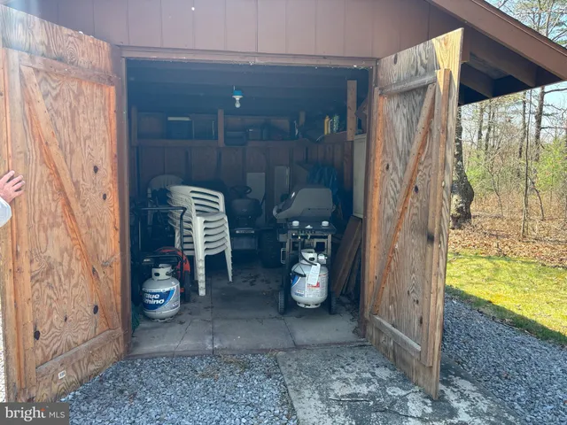 a view of a porch with a door and a porch