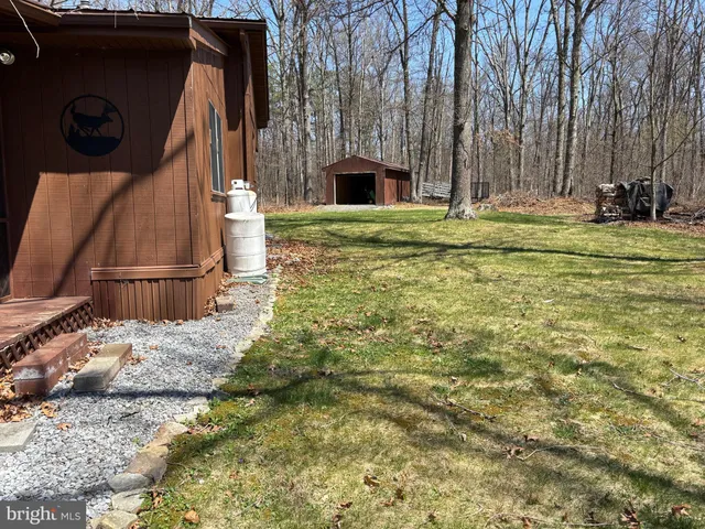 a view of swimming pool with a yard