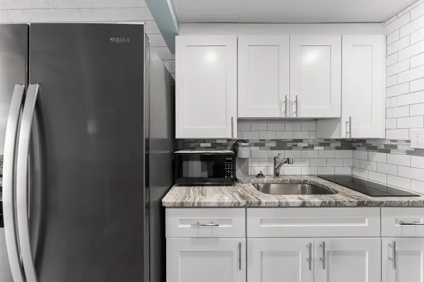 a kitchen with a sink and cabinets