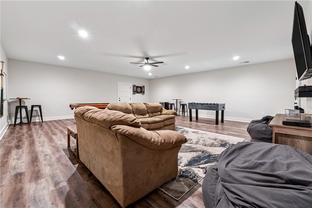 38 Mountain Ridge Road Northeast White, GA 30184 - Photo 60 of 79 a living room with furniture and a flat screen tv