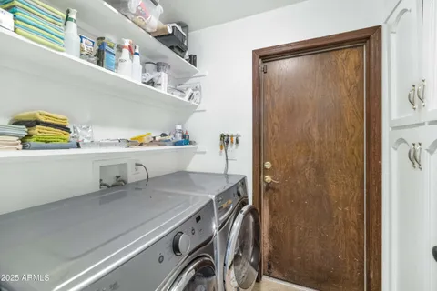 a utility room with a sink a washer and dryer