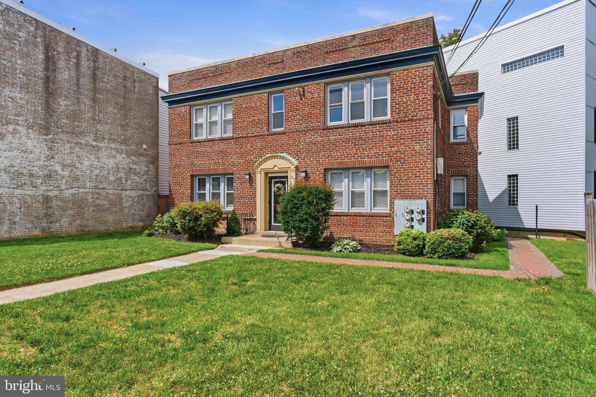 2712 6th Street Northeast Washington, DC 20017 - Photo 3 of 24 a front view of a house with a yard