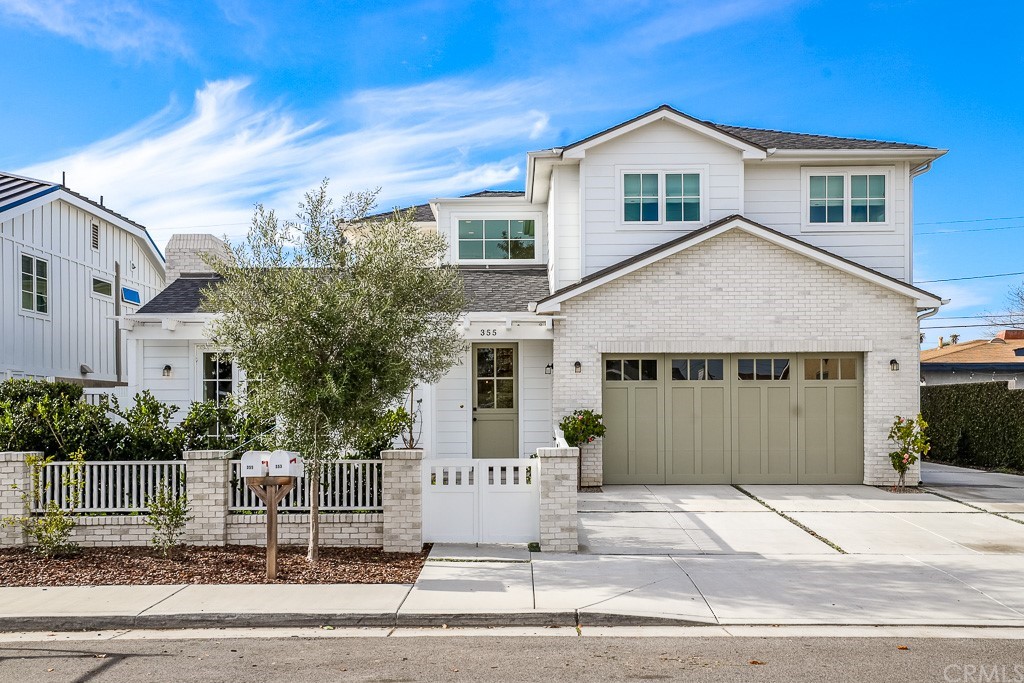 355 Rochester Street Costa Mesa, CA 92627 - Photo 1 of 34 a front view of a house with a garden