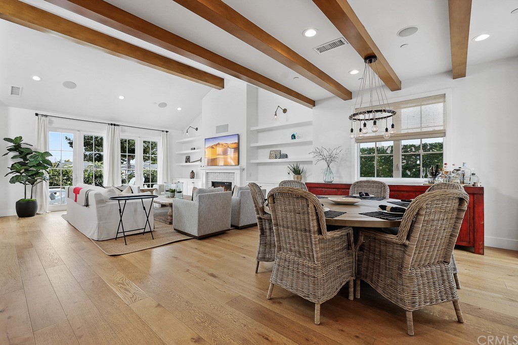 355 Rochester Street Costa Mesa, CA 92627 - Photo 12 of 34 a dining room with furniture and wooden floor